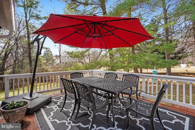 deck with outdoor dining area