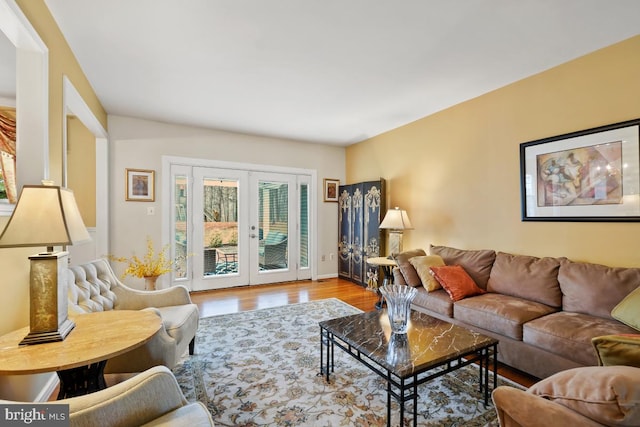 living room featuring french doors and wood finished floors