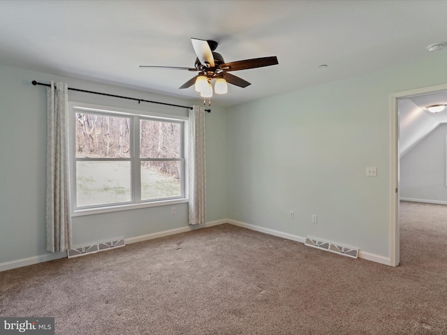 unfurnished room with carpet flooring, baseboards, visible vents, and ceiling fan