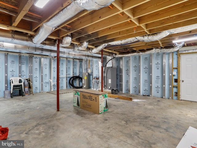 unfinished basement with water heater and heating unit