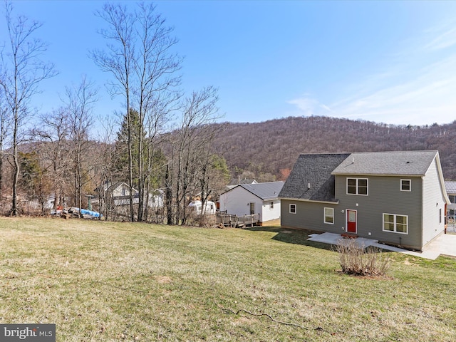 exterior space with a wooded view