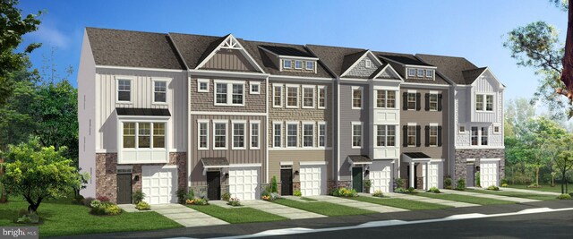 townhome / multi-family property featuring stone siding and board and batten siding