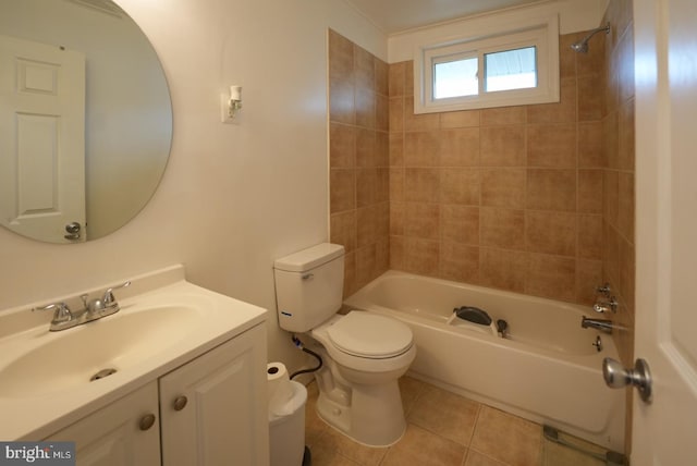 full bath featuring tile patterned flooring, toilet, vanity, and washtub / shower combination