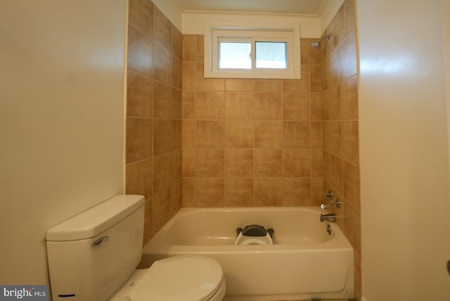 bathroom with shower / bathing tub combination and toilet