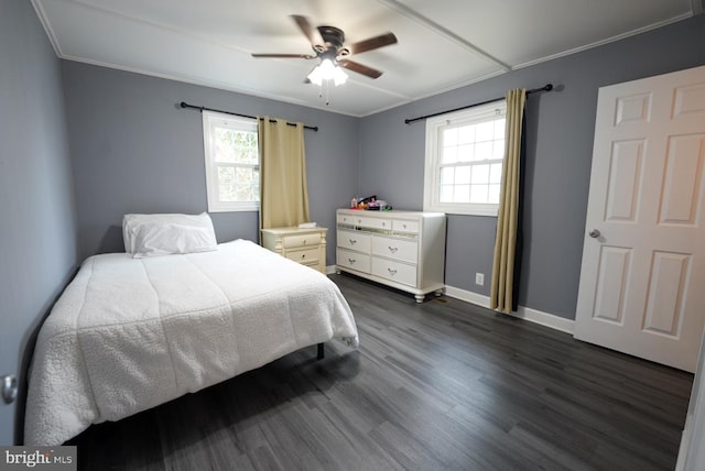 bedroom featuring baseboards, a ceiling fan, dark wood-style floors, and crown molding