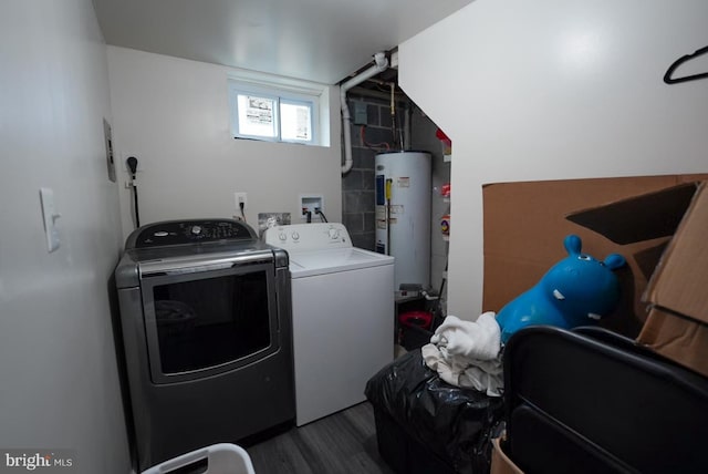 washroom with separate washer and dryer, wood finished floors, and electric water heater