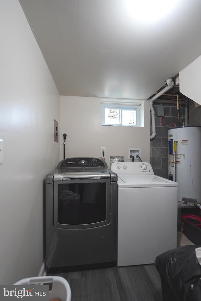 laundry room featuring independent washer and dryer, wood finished floors, water heater, and laundry area