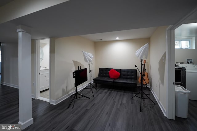 living area with dark wood finished floors, recessed lighting, washing machine and dryer, and baseboards