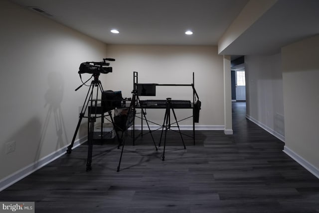 exercise room featuring visible vents, recessed lighting, wood finished floors, and baseboards