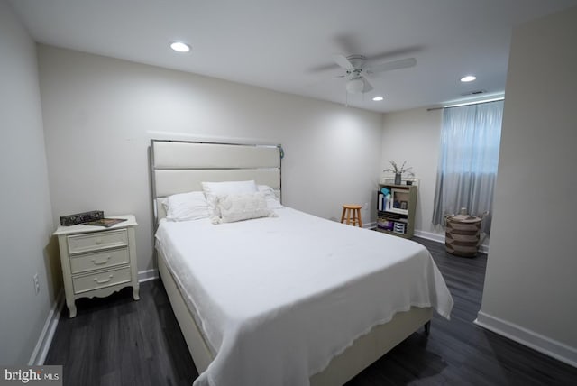 bedroom with dark wood finished floors, recessed lighting, a ceiling fan, and baseboards