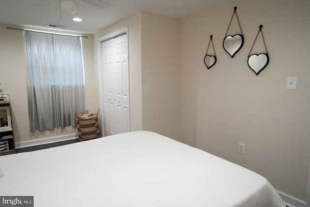 bedroom with visible vents, a closet, and ceiling fan