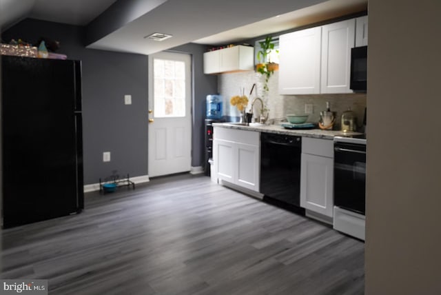 kitchen featuring black appliances, a sink, backsplash, dark wood finished floors, and white cabinets