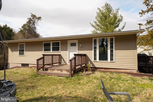 view of front of house featuring a deck and a front yard