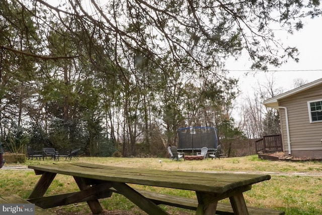 view of yard with a trampoline