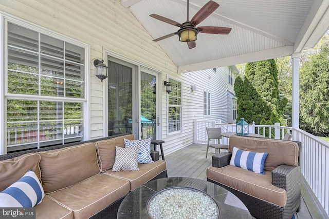 exterior space featuring an outdoor hangout area and ceiling fan