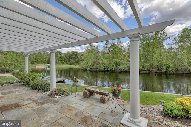 view of patio / terrace featuring a pergola and a water view