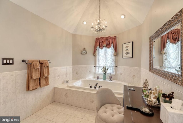 bathroom featuring tile patterned floors, a notable chandelier, a bath, and vaulted ceiling