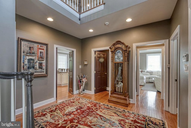 entrance foyer featuring recessed lighting, light wood-type flooring, and baseboards