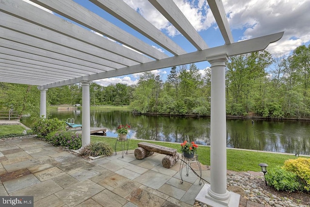 view of patio featuring a pergola and a water view