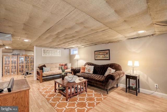 living room with baseboards and wood finished floors