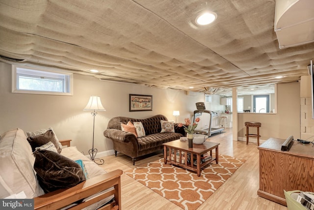 living room featuring light wood-style floors and baseboards