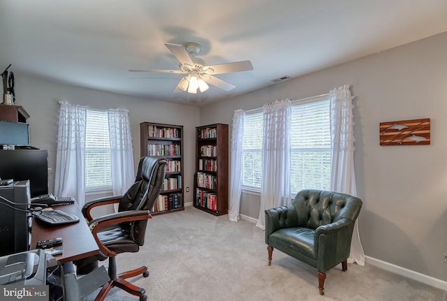 home office featuring visible vents, baseboards, carpet, and a ceiling fan