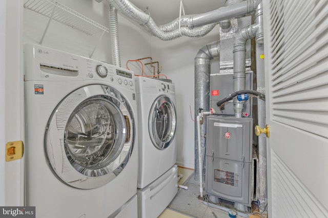 clothes washing area with laundry area and separate washer and dryer