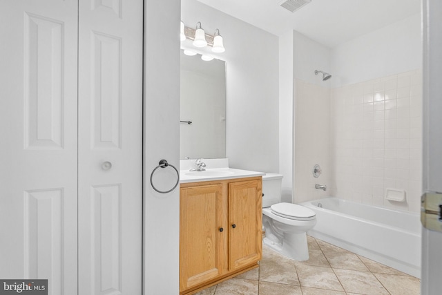 bathroom featuring vanity, visible vents, bathtub / shower combination, tile patterned floors, and toilet