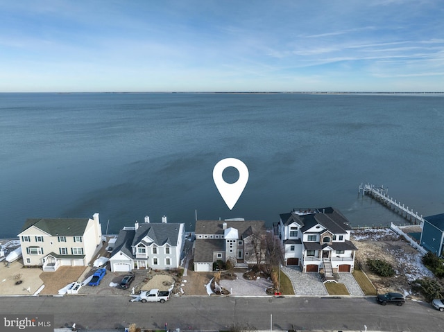 birds eye view of property featuring a residential view and a water view