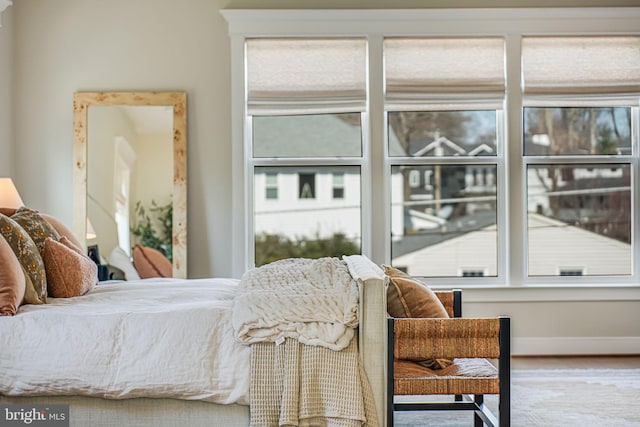 bedroom featuring baseboards and wood finished floors