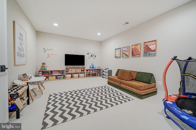 recreation room featuring carpet flooring, recessed lighting, and visible vents