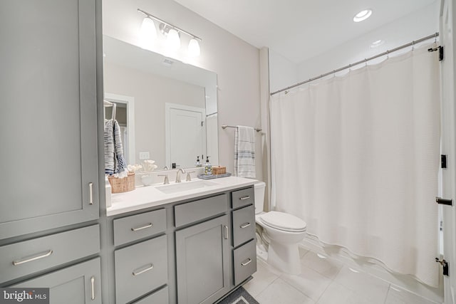 full bath with tile patterned floors, toilet, and vanity