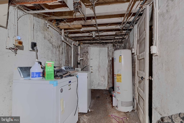 unfinished below grade area with gas water heater and washer and dryer