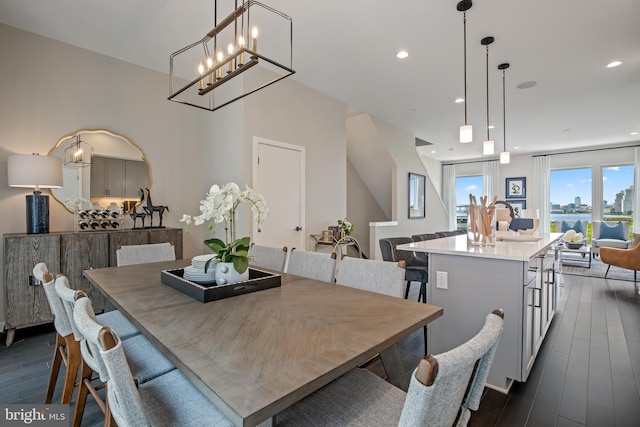 dining area with dark wood finished floors and recessed lighting