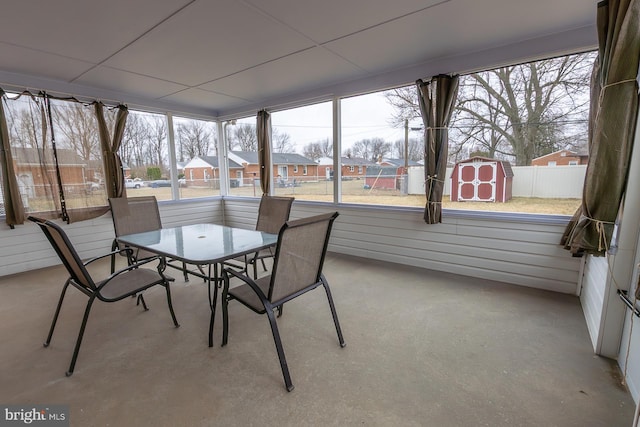 unfurnished sunroom featuring a residential view