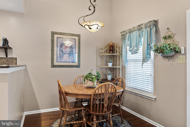 dining room with wood finished floors and baseboards