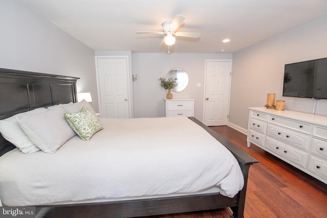 bedroom with a ceiling fan, recessed lighting, dark wood-style floors, and baseboards