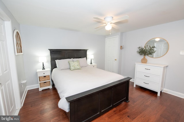 bedroom featuring dark wood-style floors, baseboards, and ceiling fan