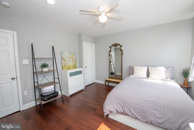 bedroom featuring a ceiling fan, wood finished floors, and baseboards