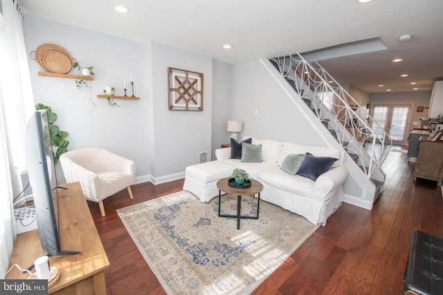 living room featuring stairway, recessed lighting, dark wood-type flooring, and baseboards