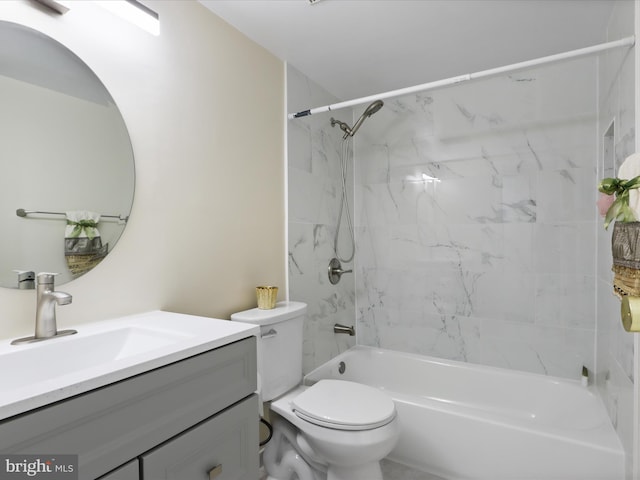 bathroom featuring shower / bathing tub combination, toilet, and vanity