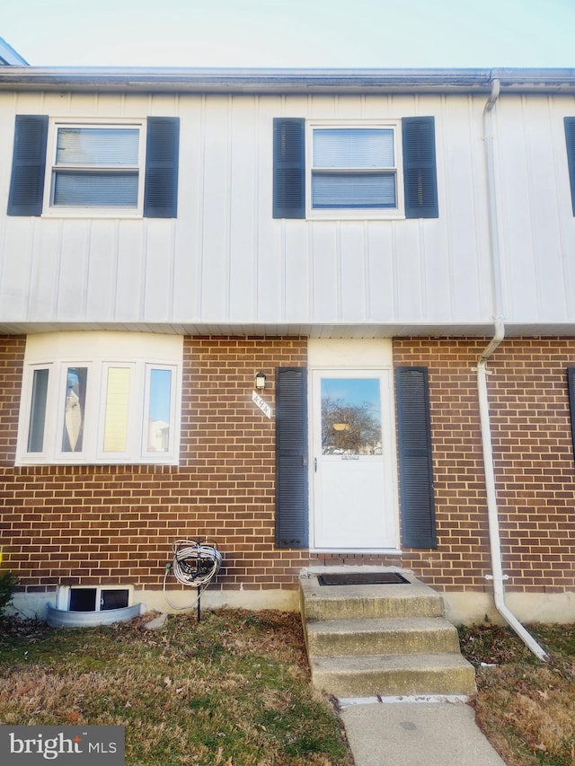 view of property featuring brick siding