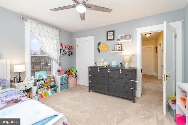 carpeted bedroom featuring ceiling fan