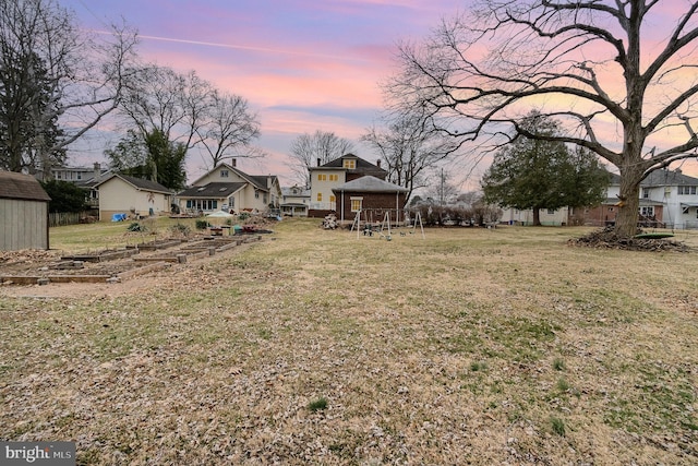 yard at dusk with an outdoor structure