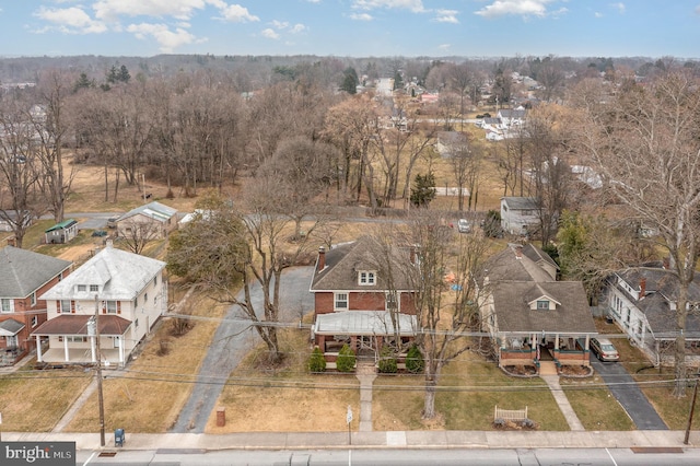 birds eye view of property with a residential view