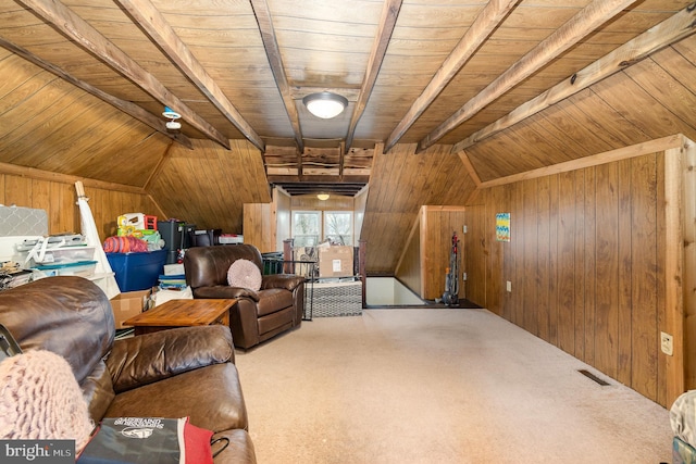 unfurnished living room featuring visible vents, wood ceiling, carpet, and wooden walls