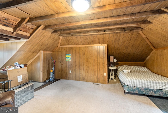 bedroom with wooden walls, wooden ceiling, lofted ceiling with beams, and carpet