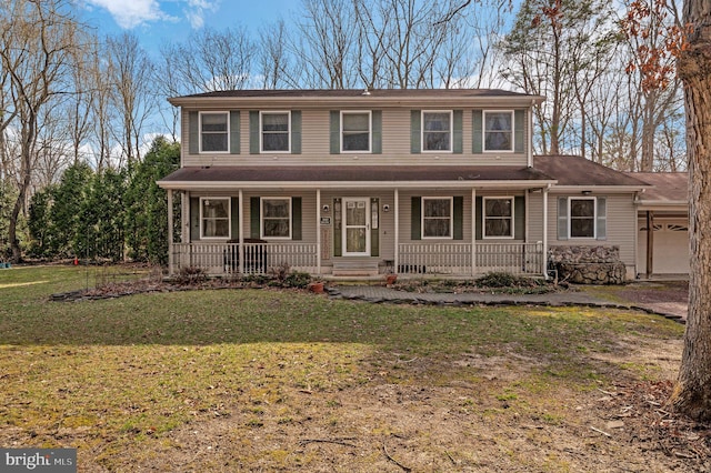 view of front of property with a porch and a front yard