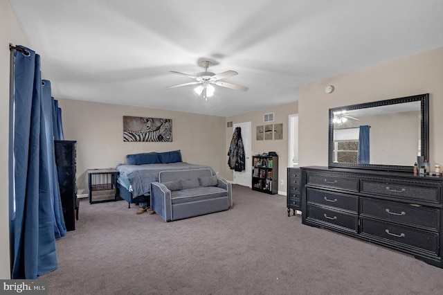 bedroom with a ceiling fan, carpet, and baseboards