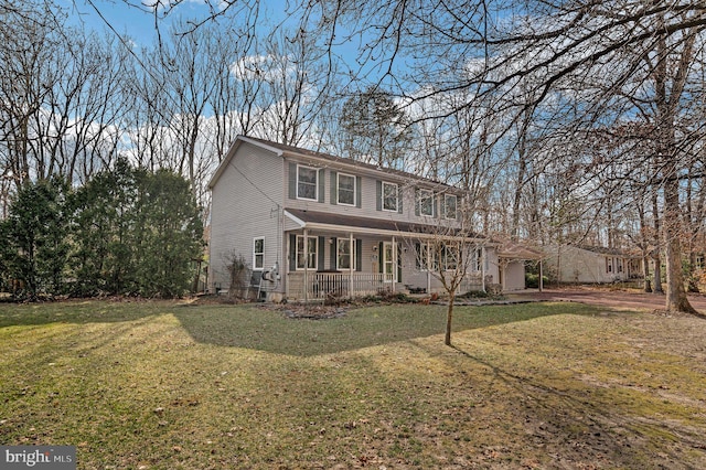 view of front of house featuring a porch and a front yard